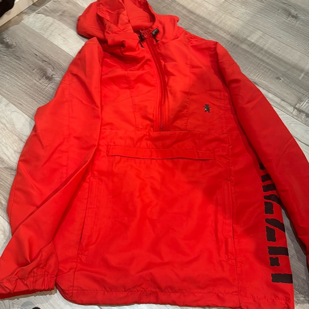 Red half zip wind breaker